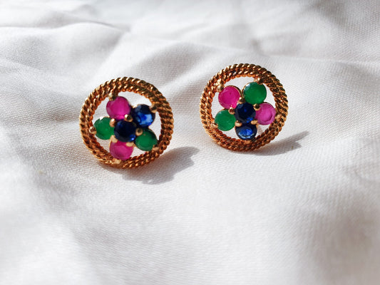 Multi color stones adorned with twisted silver wire-